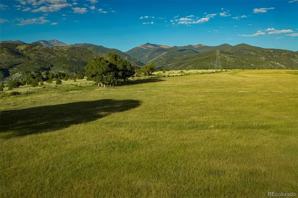 a view of an ocean from a mountain