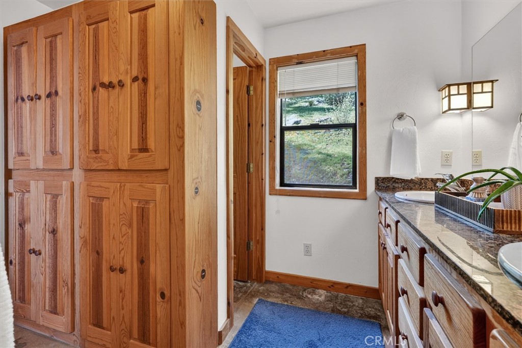 5851 Mt Bullion Ridge Road Mariposa, CA 95338 - Photo 22 of 58 a view of a kitchen with an entryway and wooden floor