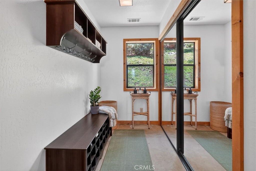 5851 Mt Bullion Ridge Road Mariposa, CA 95338 - Photo 25 of 58 a view of hallway with furniture and a large window