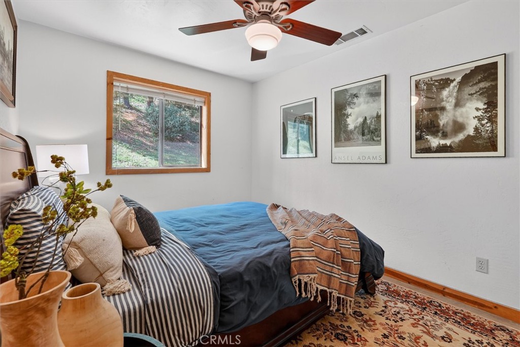 5851 Mt Bullion Ridge Road Mariposa, CA 95338 - Photo 28 of 58 a bedroom with furniture and a window