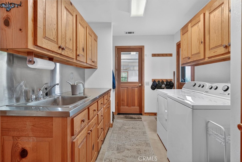5851 Mt Bullion Ridge Road Mariposa, CA 95338 - Photo 30 of 58 a kitchen that has a sink and a stove