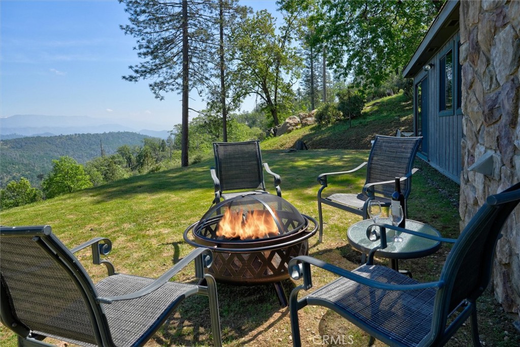 5851 Mt Bullion Ridge Road Mariposa, CA 95338 - Photo 33 of 58 a view of a swimming pool with sitting area