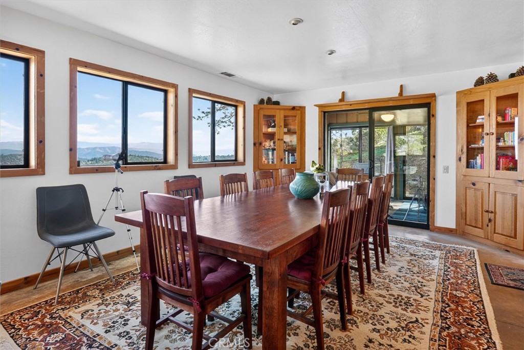 5851 Mt Bullion Ridge Road Mariposa, CA 95338 - Photo 8 of 58 a view of a dining room with furniture window and outside view