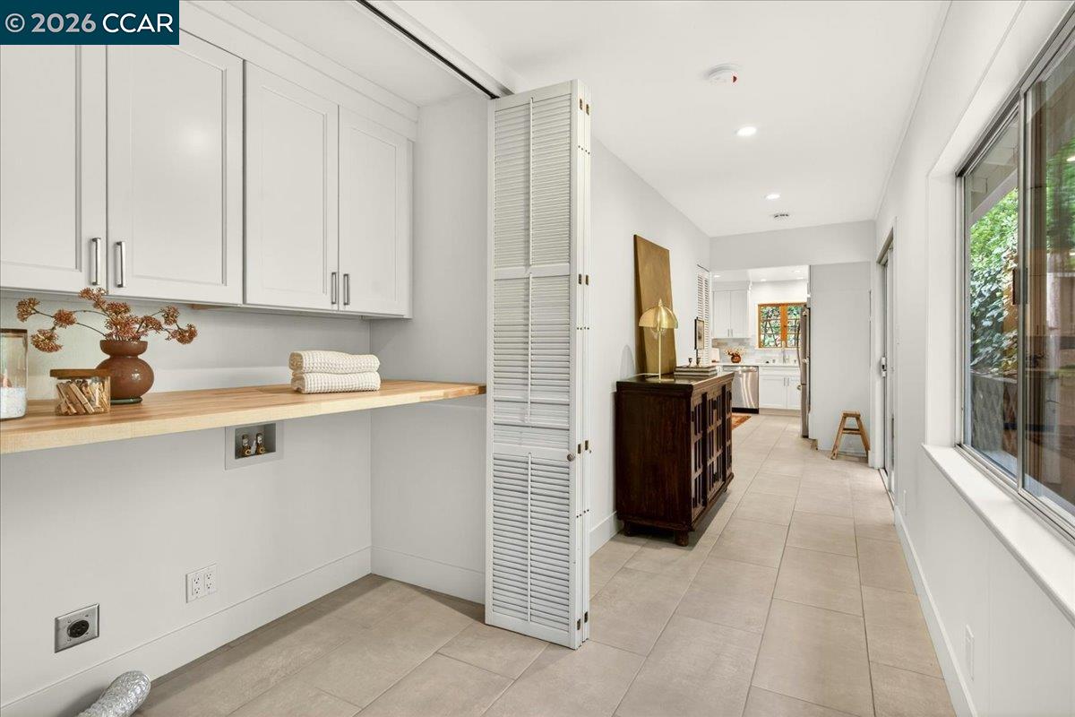 24 Las Vegas Road Orinda, CA 94563 - Photo 17 of 47 a kitchen with a refrigerator and white cabinets