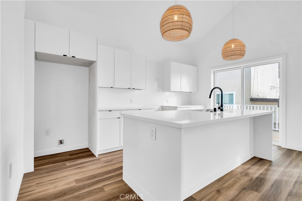 226 B Arena Street, Unit B El Segundo, CA 90245 - Photo 11 of 20 a kitchen with a sink cabinets and wooden floor