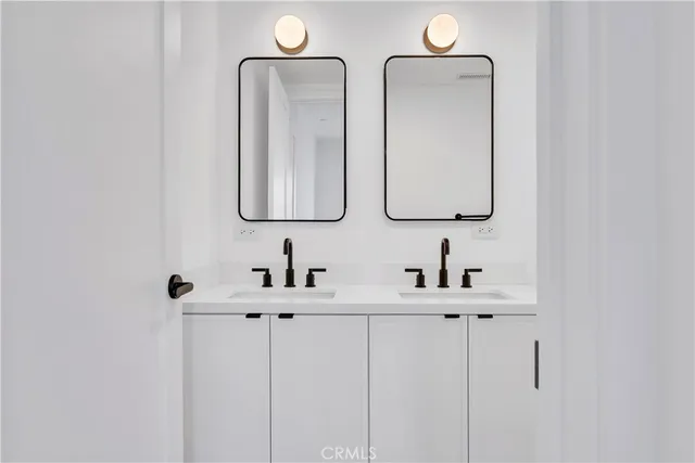 a bathroom with a toilet sink a shower and mirror