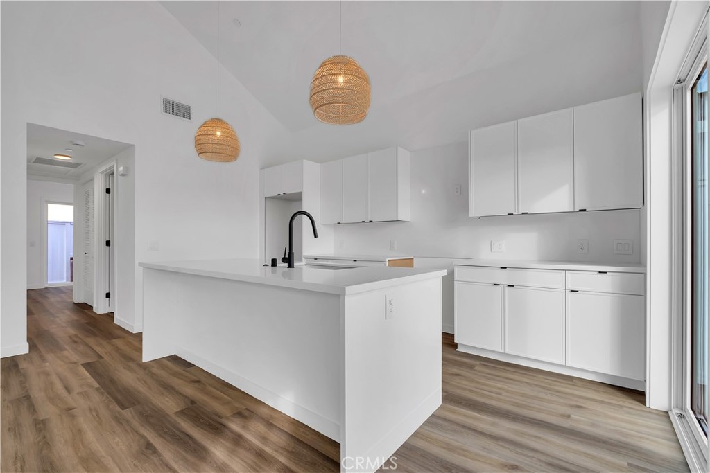 226 B Arena Street, Unit B El Segundo, CA 90245 - Photo 9 of 20 a kitchen with cabinets and wooden floor