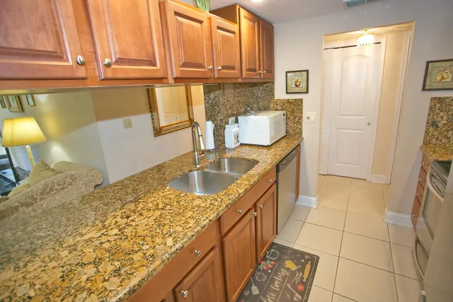 a stove top oven sitting inside of a kitchen