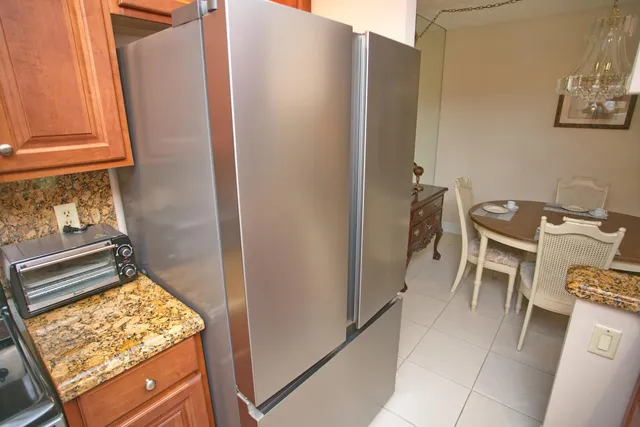 a bed room with a bed and painting on the wall