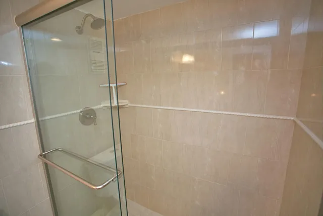 a bedroom with a bed and a dresser in it