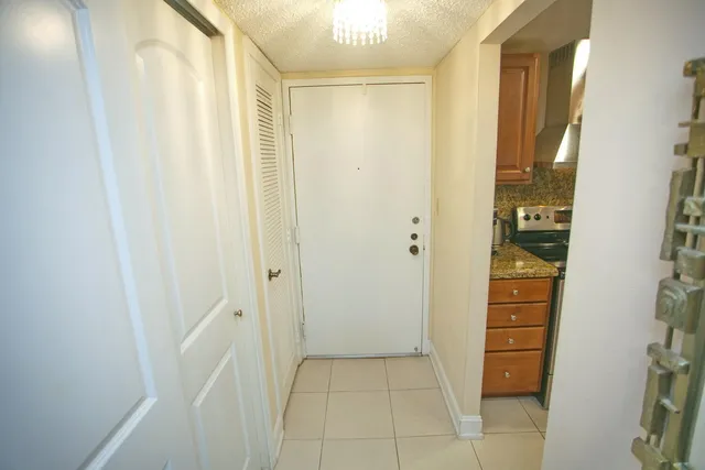 a living room with furniture a flat screen tv and a window