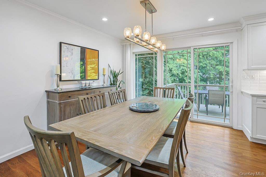 305 Stratton Road New Rochelle, NY 10804 - Photo 7 of 32 a view of a dining room with furniture window and wooden floor