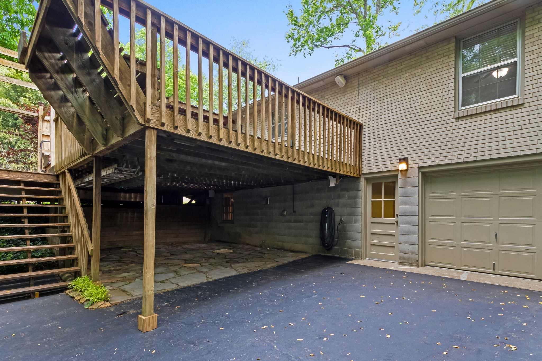 651 Hicks Road Nashville, TN 37221 - Photo 30 of 36 Limestone patio underneath deck.