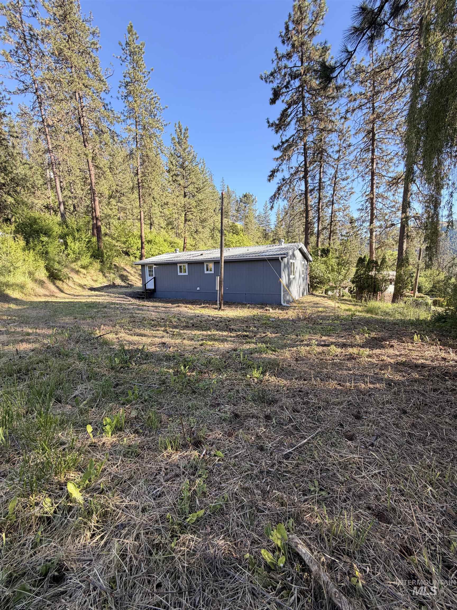151 View Road Kamiah, ID 83536 - Photo 33 of 49 Single-story structure with blue siding and white trim windows