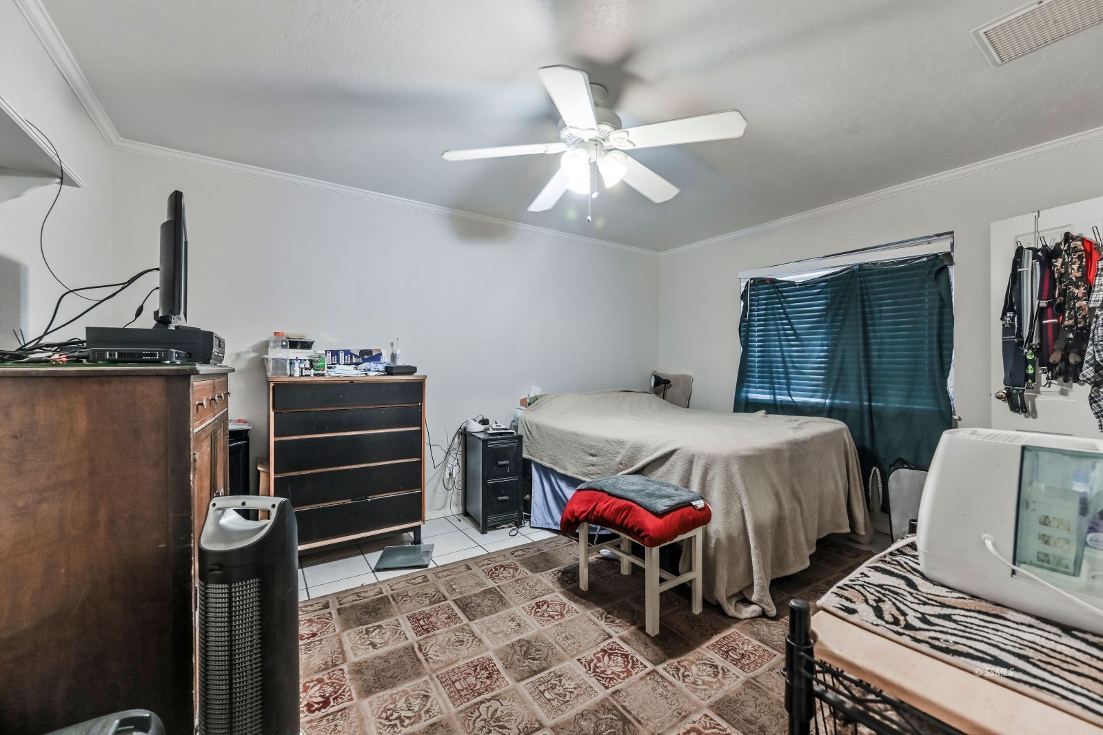 721 North Balsam Street Ridgecrest, CA 93555 - Photo 9 of 16 a bedroom with a bed and wooden floor