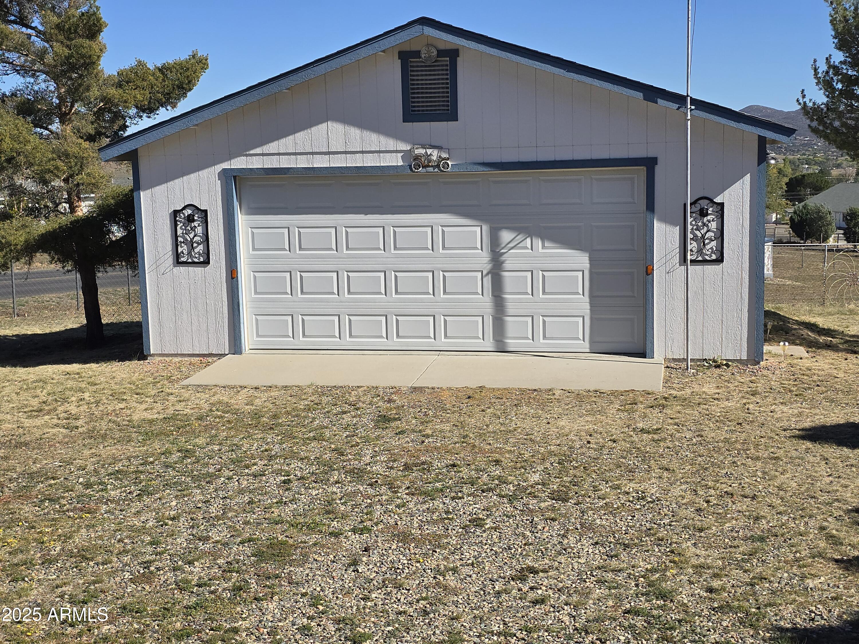 11965 Henderson Road Dewey, AZ 86327 - Photo 11 of 61 a front view of a house with a yard