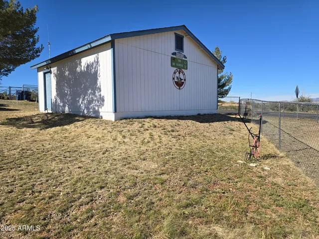 a view of a livingroom with furniture and a window