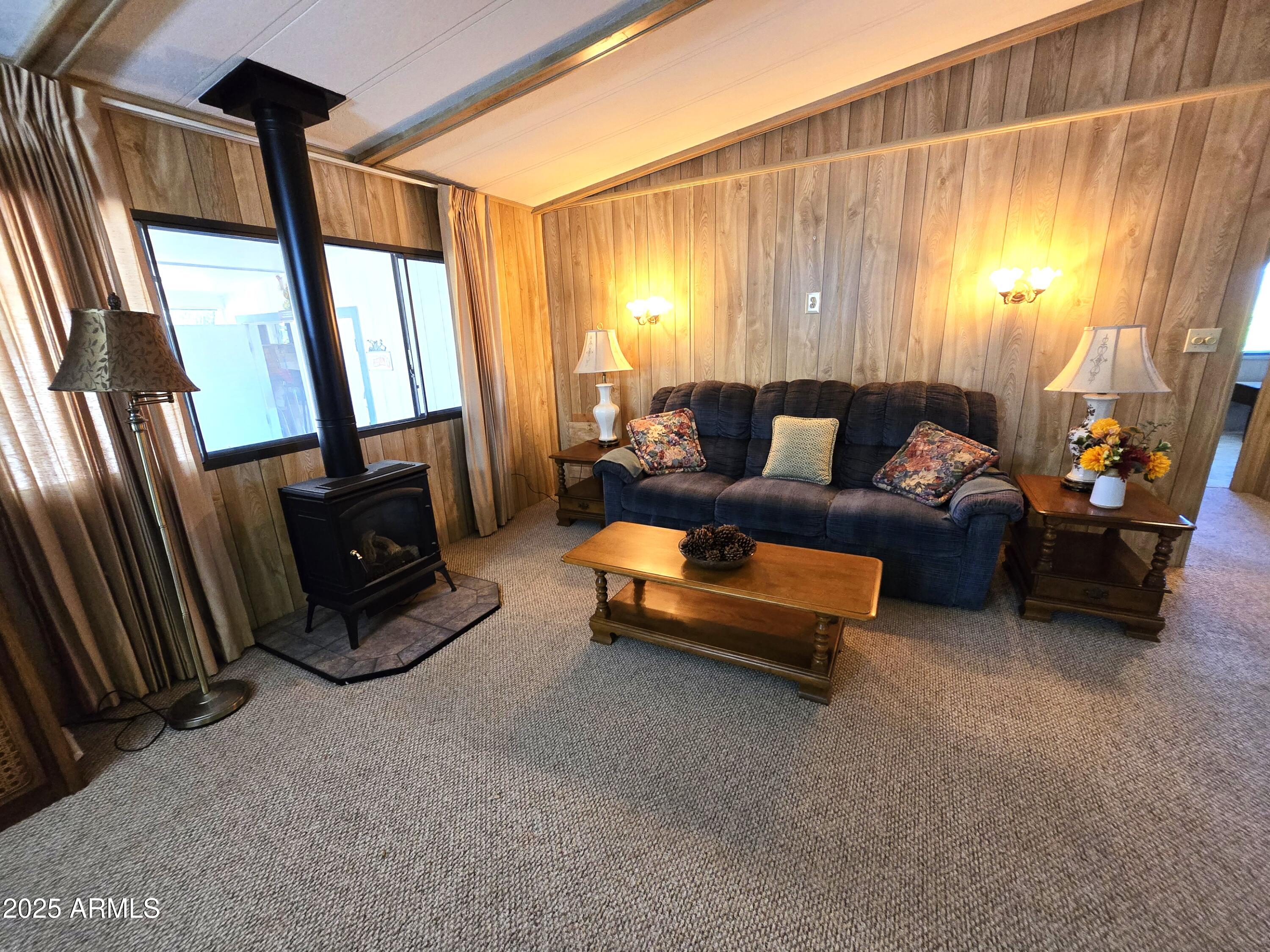 11965 Henderson Road Dewey, AZ 86327 - Photo 16 of 61 a living room with furniture and a flat screen tv