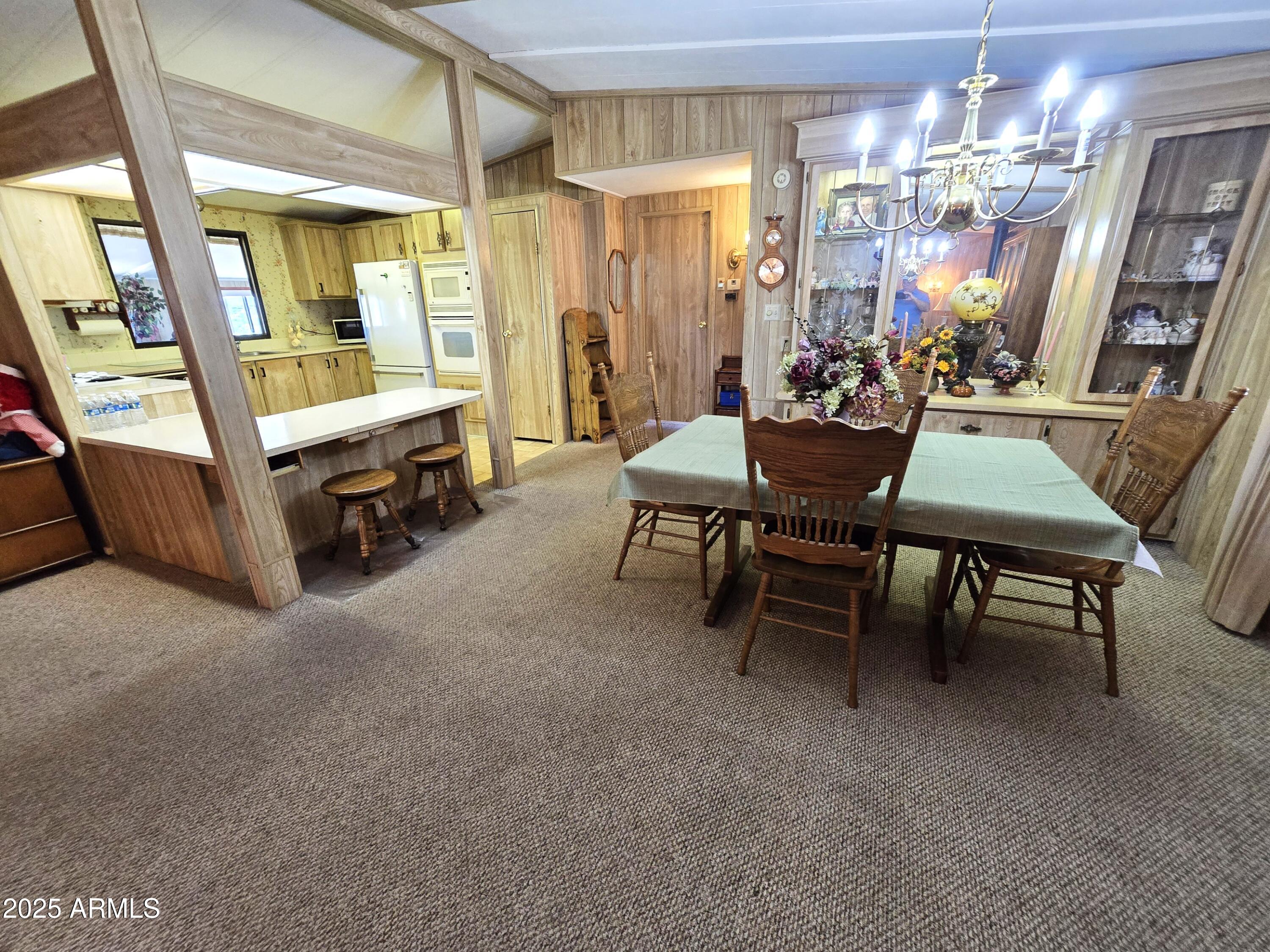 11965 Henderson Road Dewey, AZ 86327 - Photo 17 of 61 a view of a dining room with furniture window and outside view