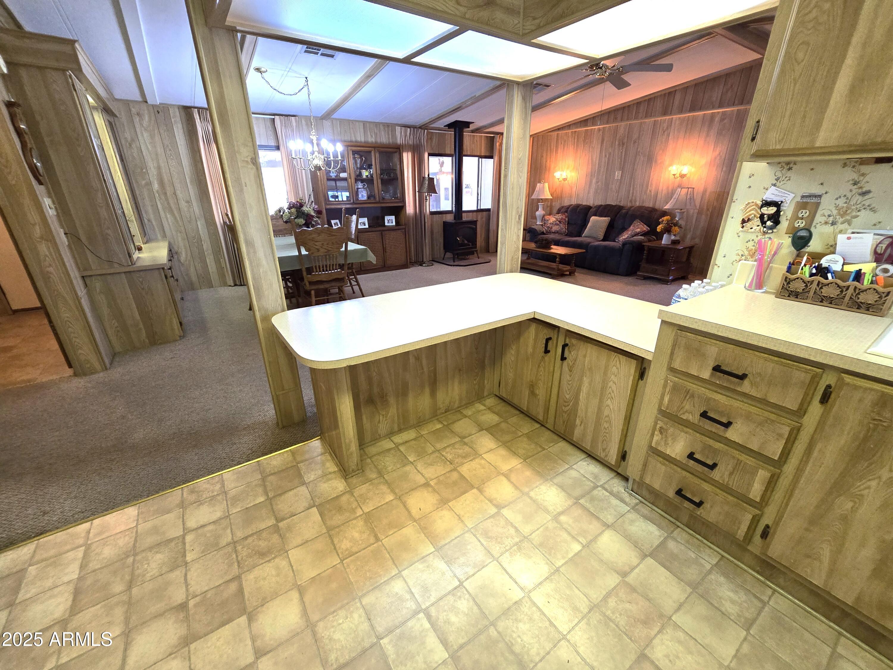 11965 Henderson Road Dewey, AZ 86327 - Photo 21 of 61 a kitchen with stainless steel appliances kitchen island granite countertop a sink and a cabinets