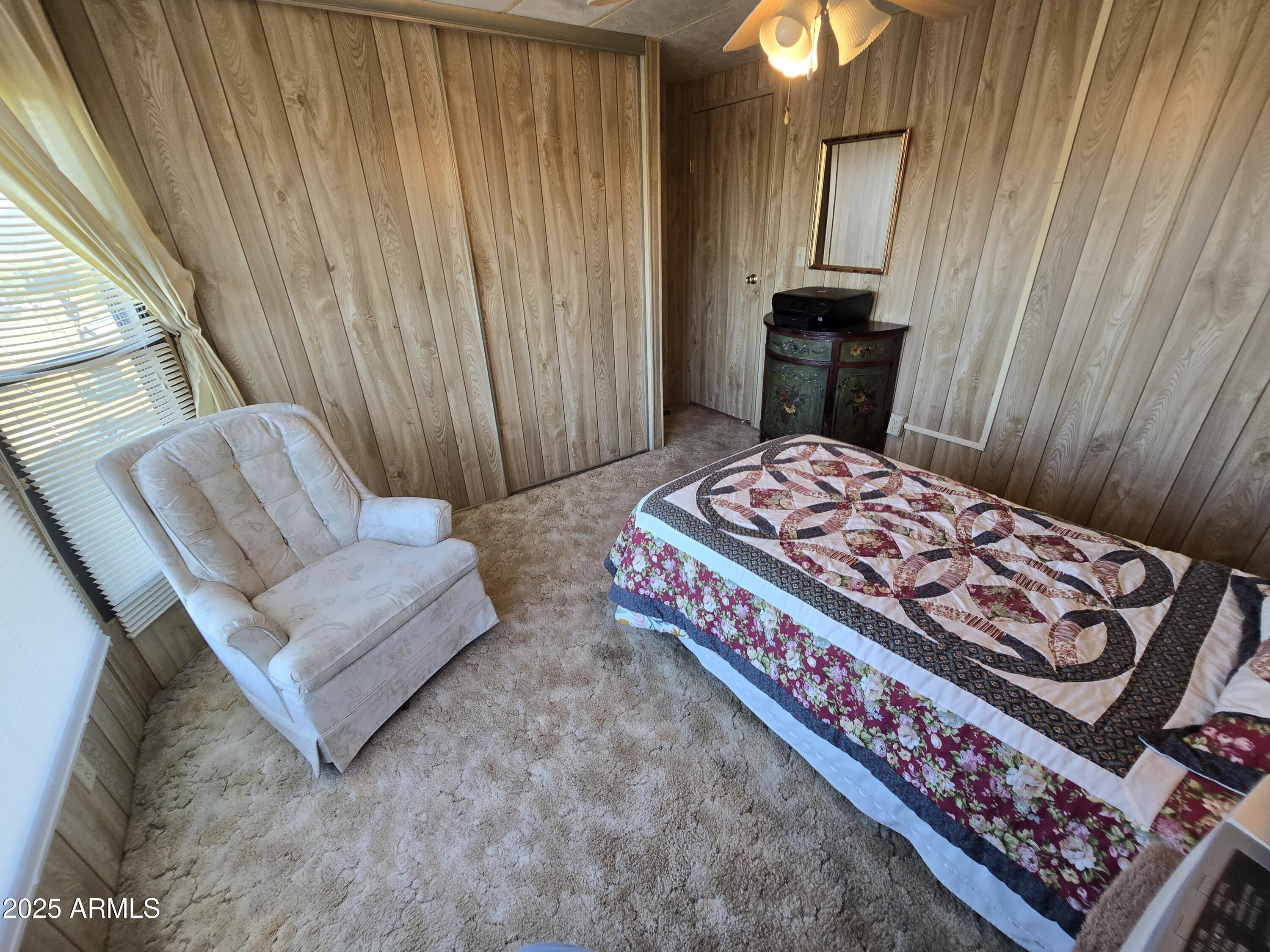 11965 Henderson Road Dewey, AZ 86327 - Photo 32 of 61 a bedroom with a bed and a couch