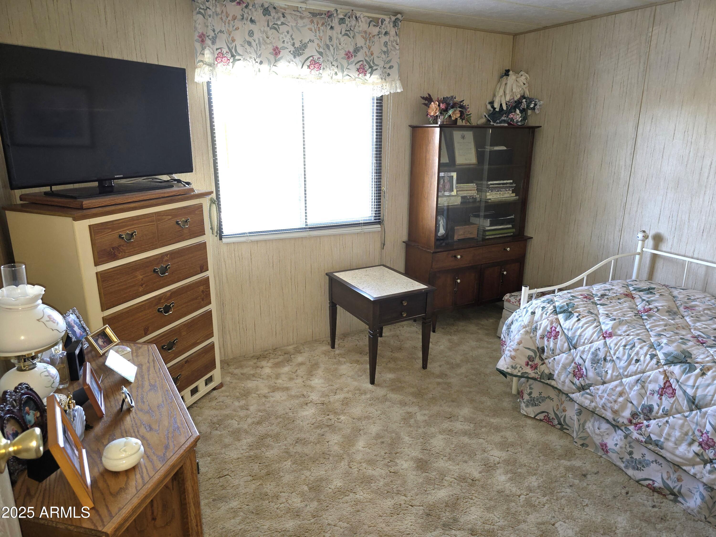 11965 Henderson Road Dewey, AZ 86327 - Photo 33 of 61 a bedroom with bed and flat screen tv