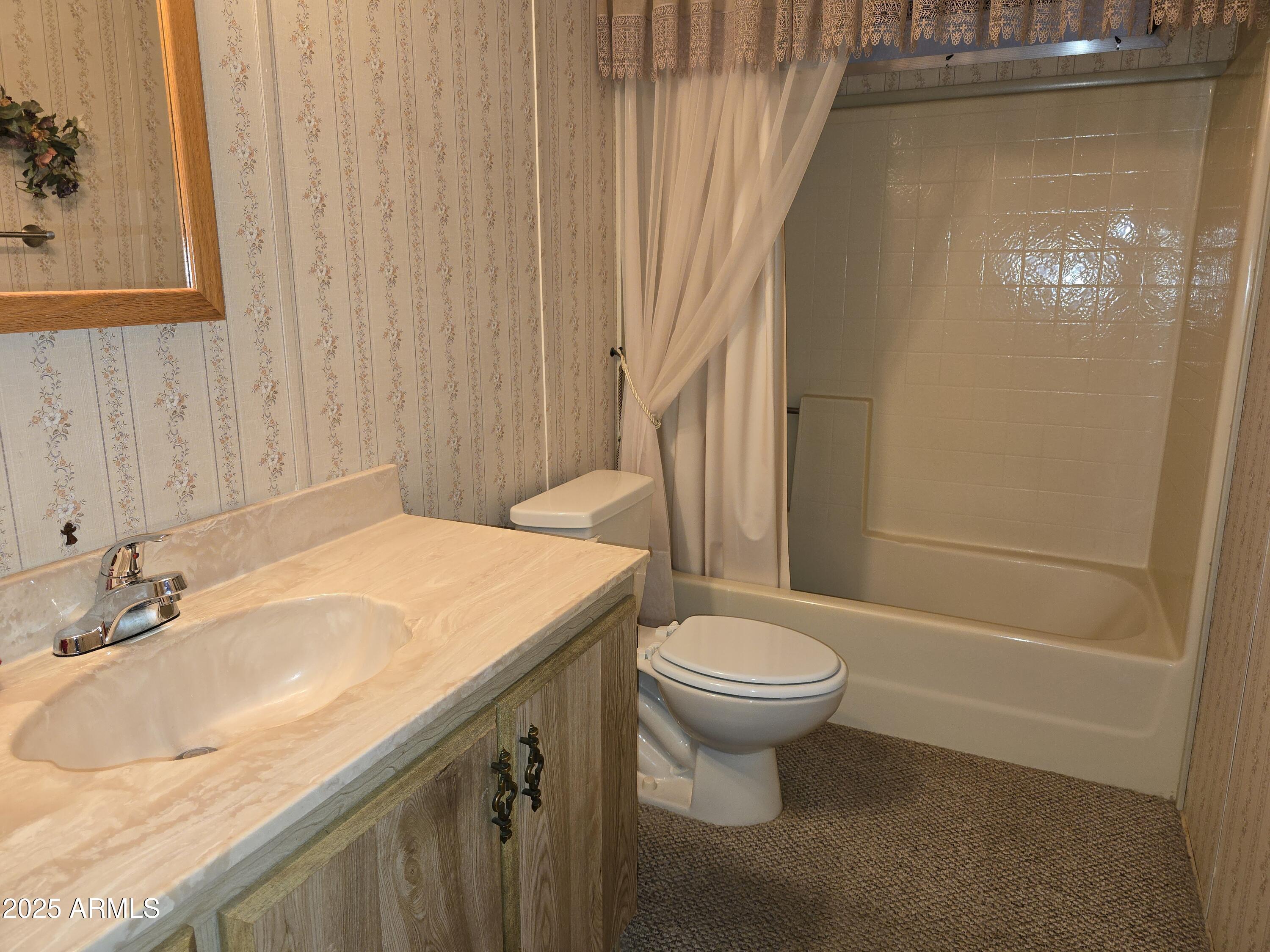 11965 Henderson Road Dewey, AZ 86327 - Photo 35 of 61 a bathroom with a sink toilet and shower