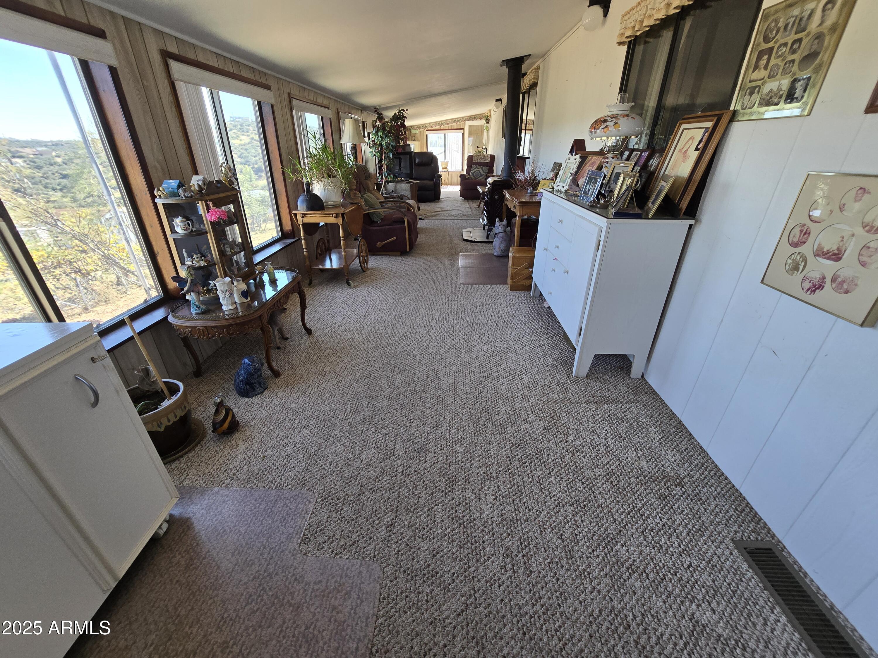 11965 Henderson Road Dewey, AZ 86327 - Photo 37 of 61 a view of living room with furniture and a flat screen tv