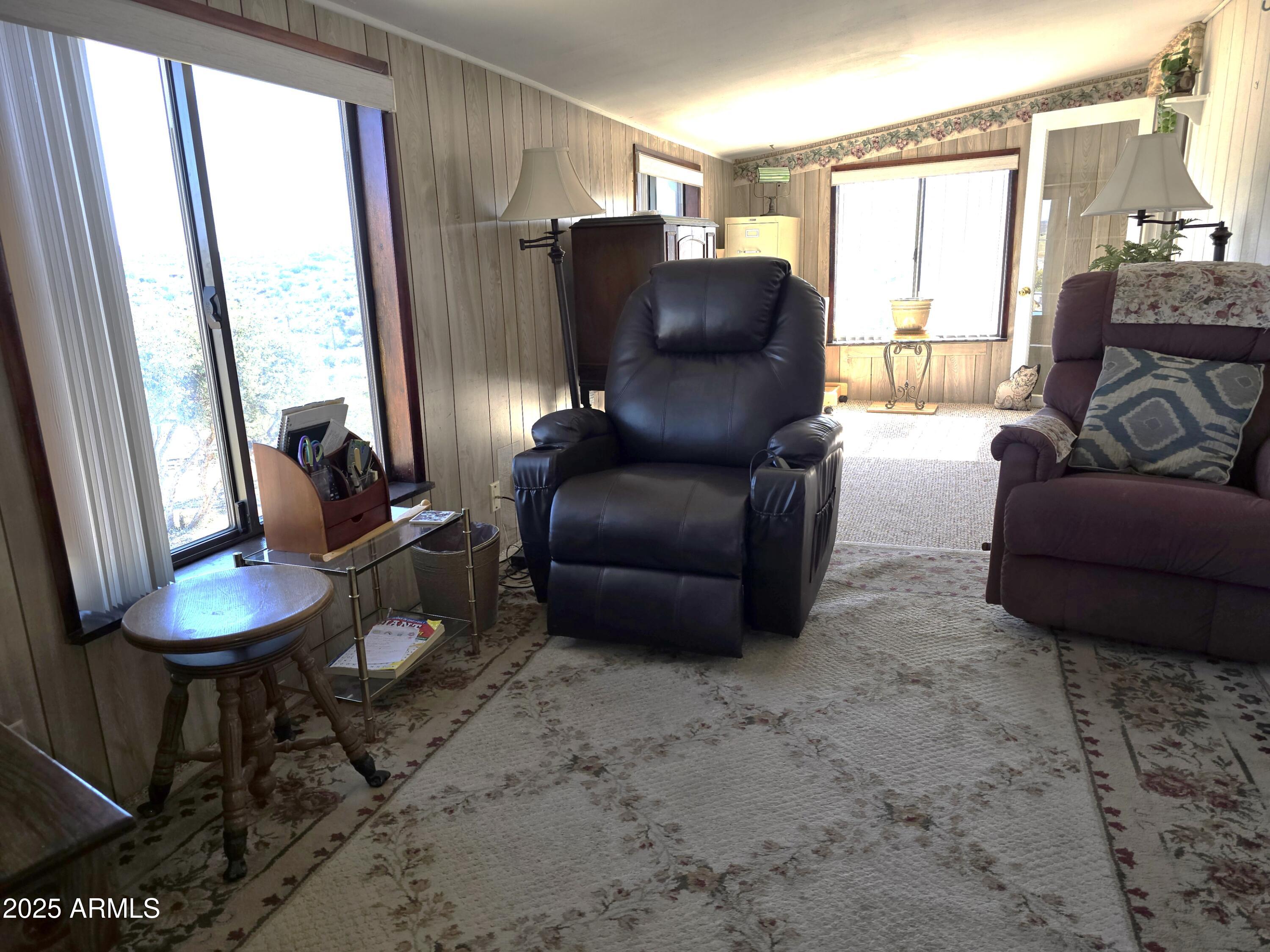 11965 Henderson Road Dewey, AZ 86327 - Photo 39 of 61 a living room with furniture and a large window