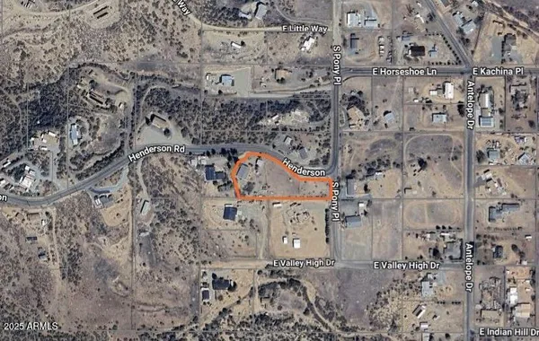 a view of a house with backyard and a tree