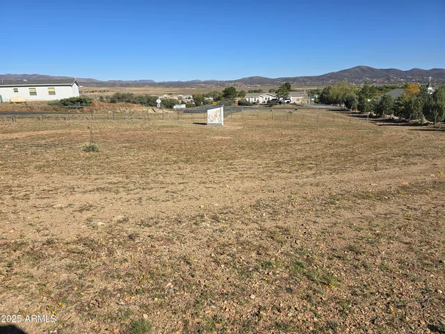 a backyard of a house with outdoor seating