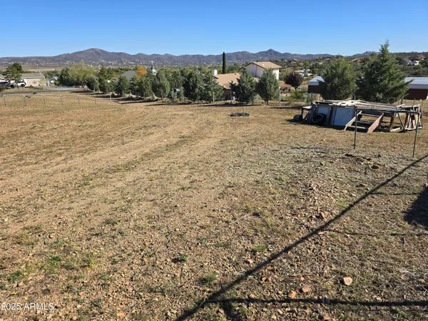 a view of a backyard of the house
