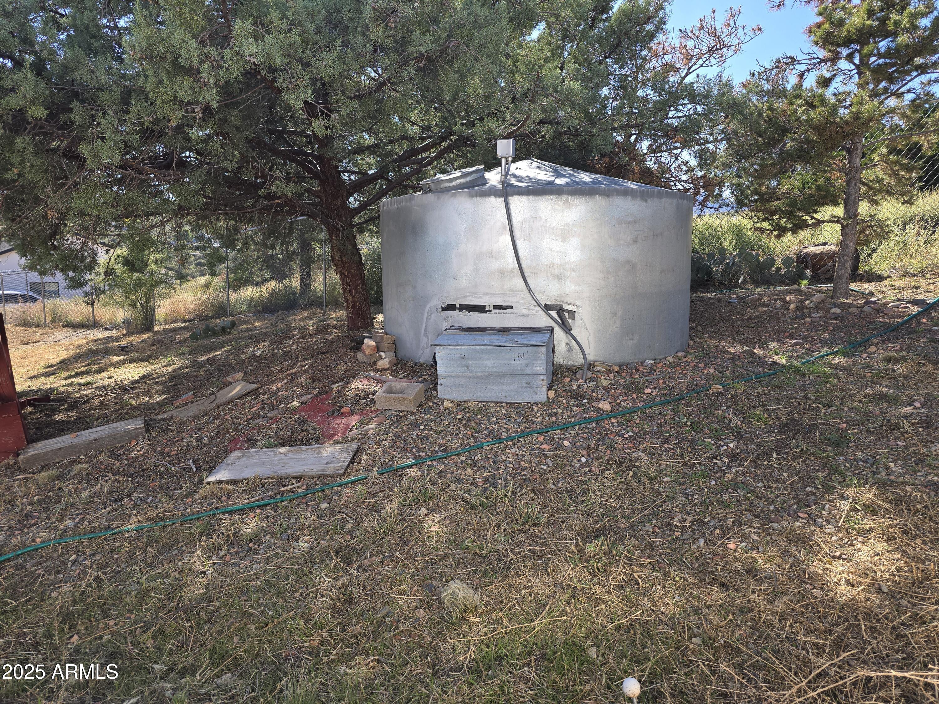 11965 Henderson Road Dewey, AZ 86327 - Photo 56 of 61 a backyard of a house with outdoor seating