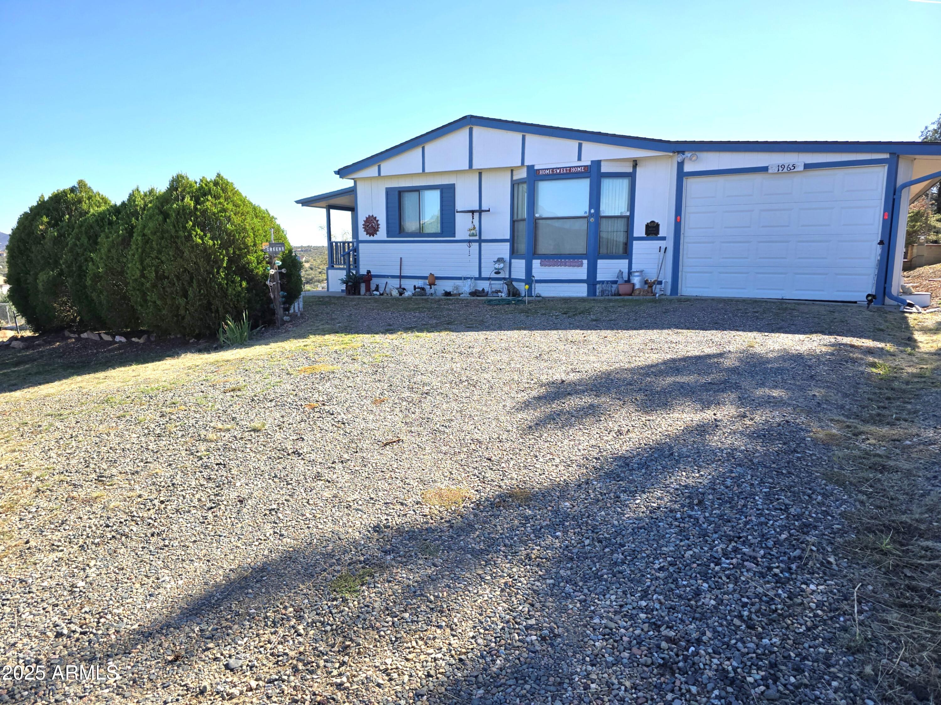 11965 Henderson Road Dewey, AZ 86327 - Photo 6 of 61 a view of a house with a yard