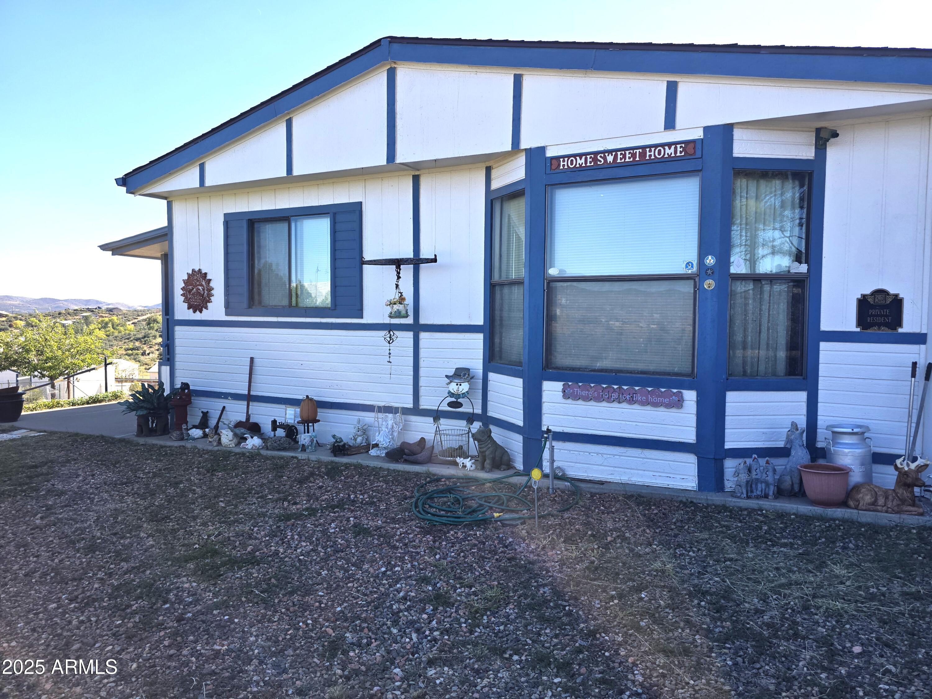 11965 Henderson Road Dewey, AZ 86327 - Photo 7 of 61 a view of a house with a yard