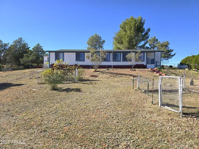 a view of a pool with a yard