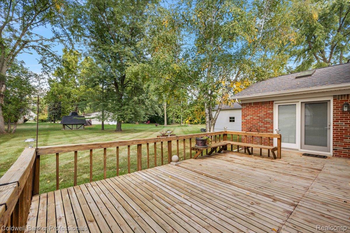 78 Carter Avenue Troy, MI 48098 - Photo 41 of 52 Wooden terrace with a yard and view of scattered trees