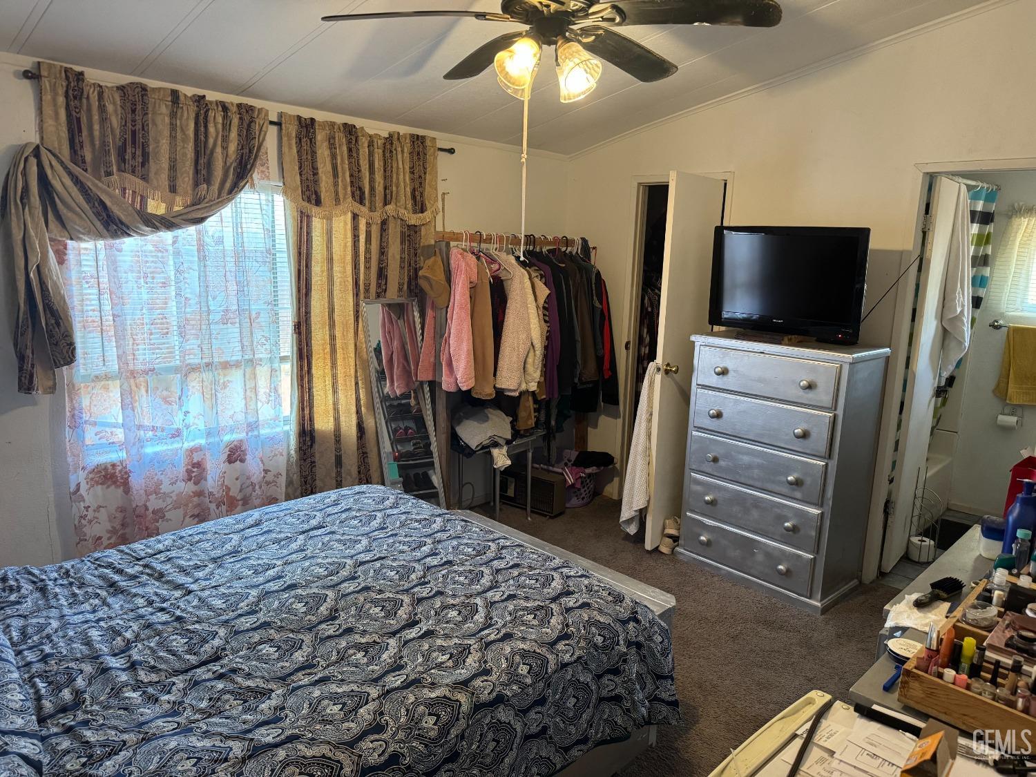 Undisclosed Address Bakersfield, CA 93307 - Photo 11 of 18 a bedroom with a bed and a television