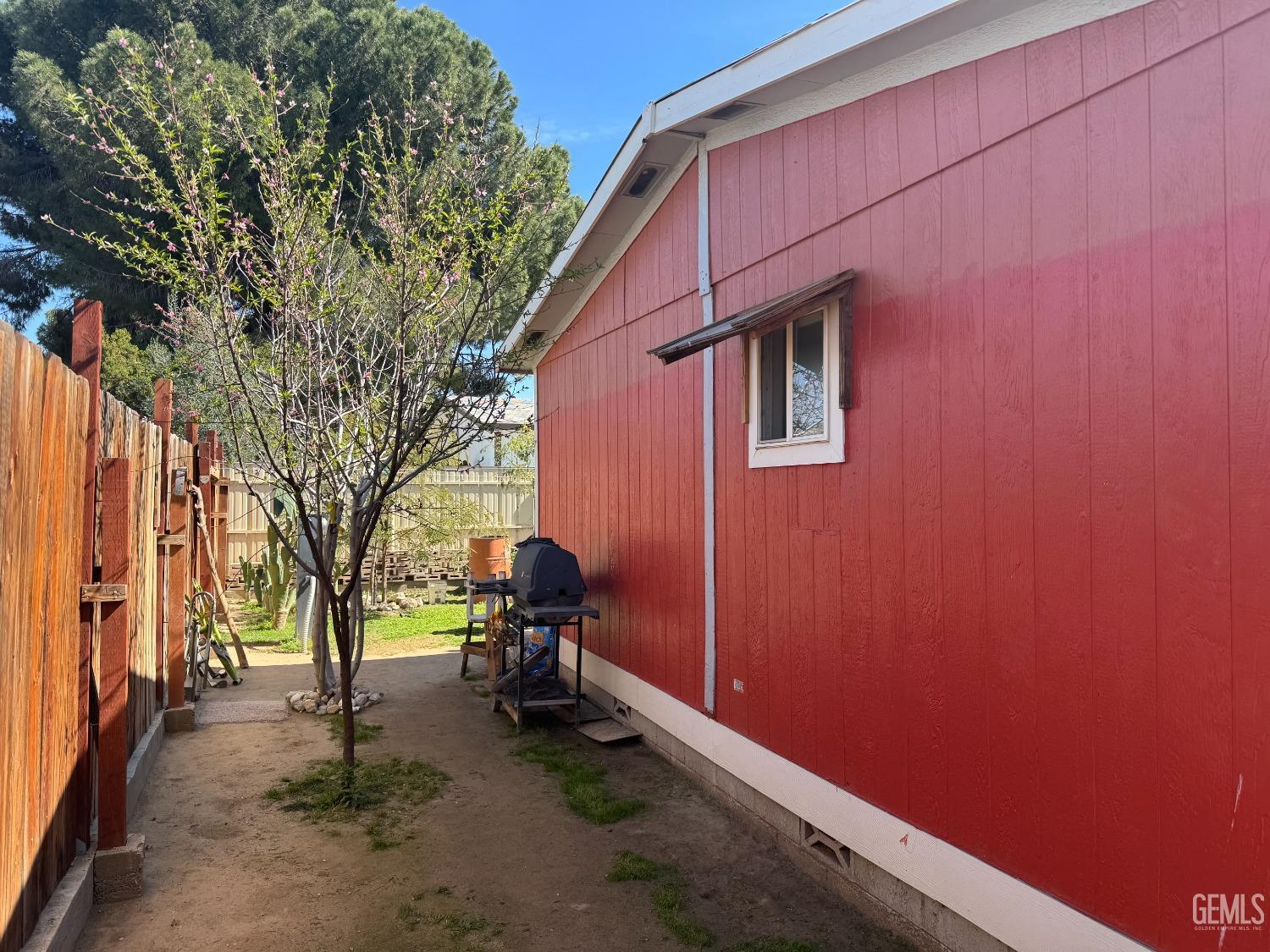 Undisclosed Address Bakersfield, CA 93307 - Photo 15 of 18 a backyard of a house with table and chairs
