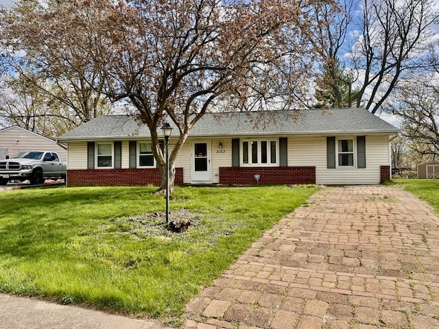 3103 Blair Drive Champaign, IL 61821 - Photo 2 of 20 a front view of a house with a yard