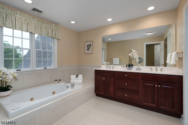 110 Orchard Road Skillman, NJ 08558 - Photo 25 of 43 a spacious bathroom with a tub sink shower and mirror