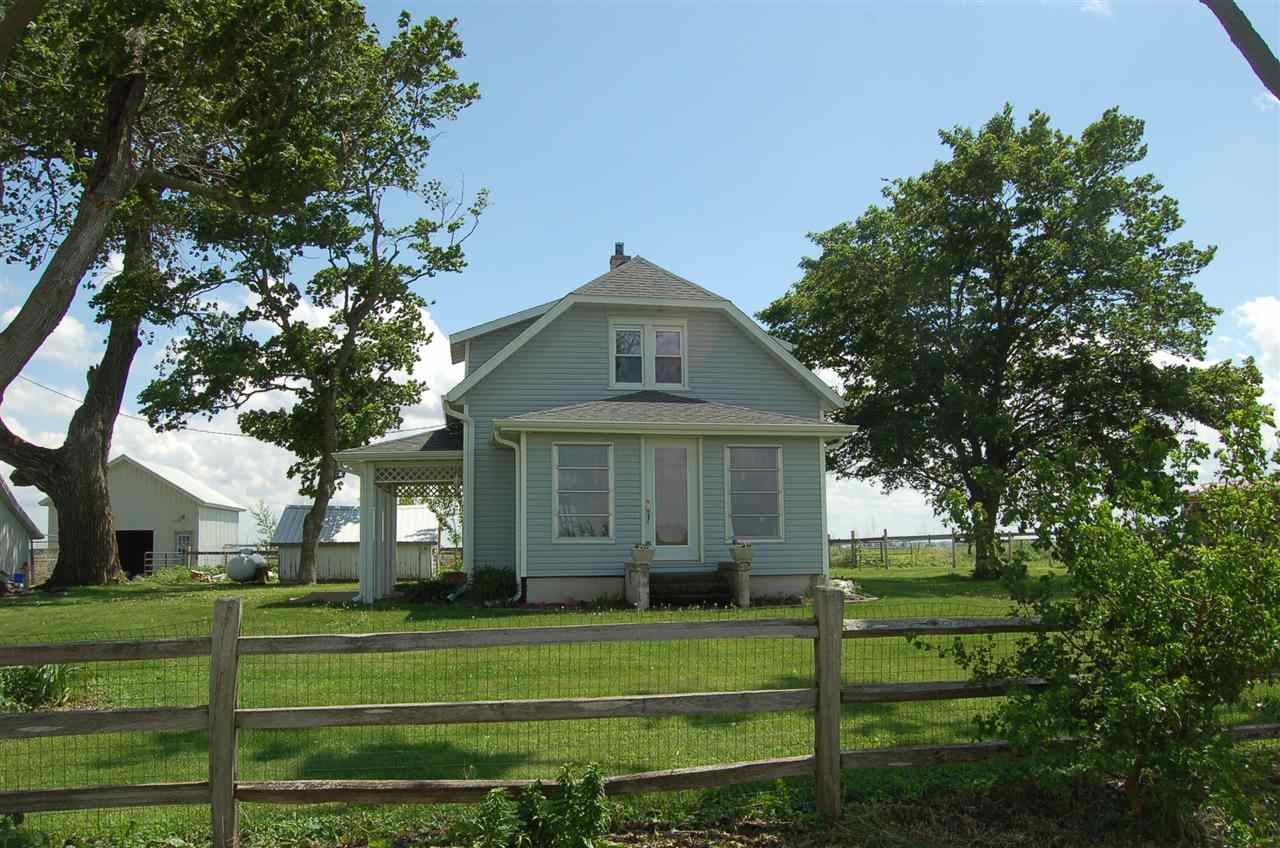 27754 West Elm Road Sterling, IL 61081 - Photo 2 of 19 a front view of a house with a garden