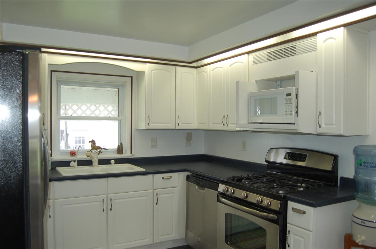 27754 West Elm Road Sterling, IL 61081 - Photo 3 of 19 a kitchen with granite countertop a sink a stove and cabinets