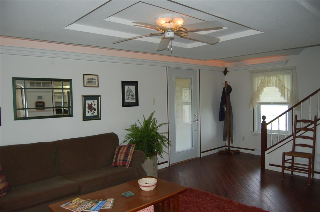 27754 West Elm Road Sterling, IL 61081 - Photo 4 of 19 a living room with furniture and a chandelier