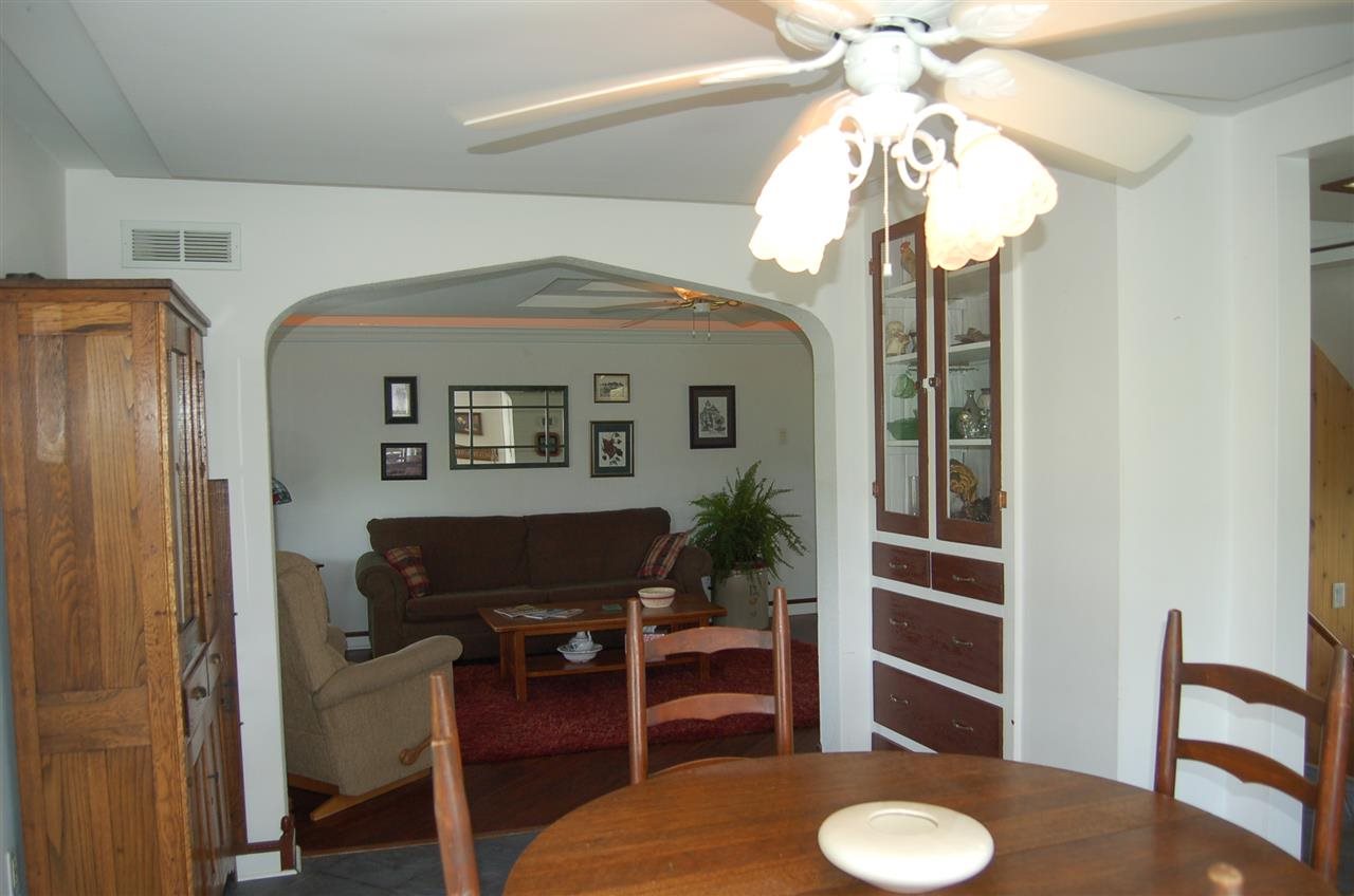 27754 West Elm Road Sterling, IL 61081 - Photo 6 of 19 a living room with furniture and a chandelier