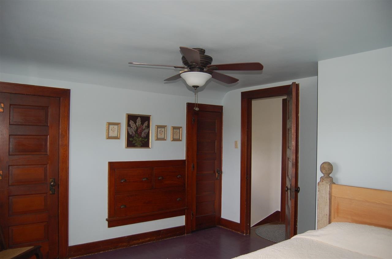 27754 West Elm Road Sterling, IL 61081 - Photo 8 of 19 a bedroom with a bed and a ceiling fan
