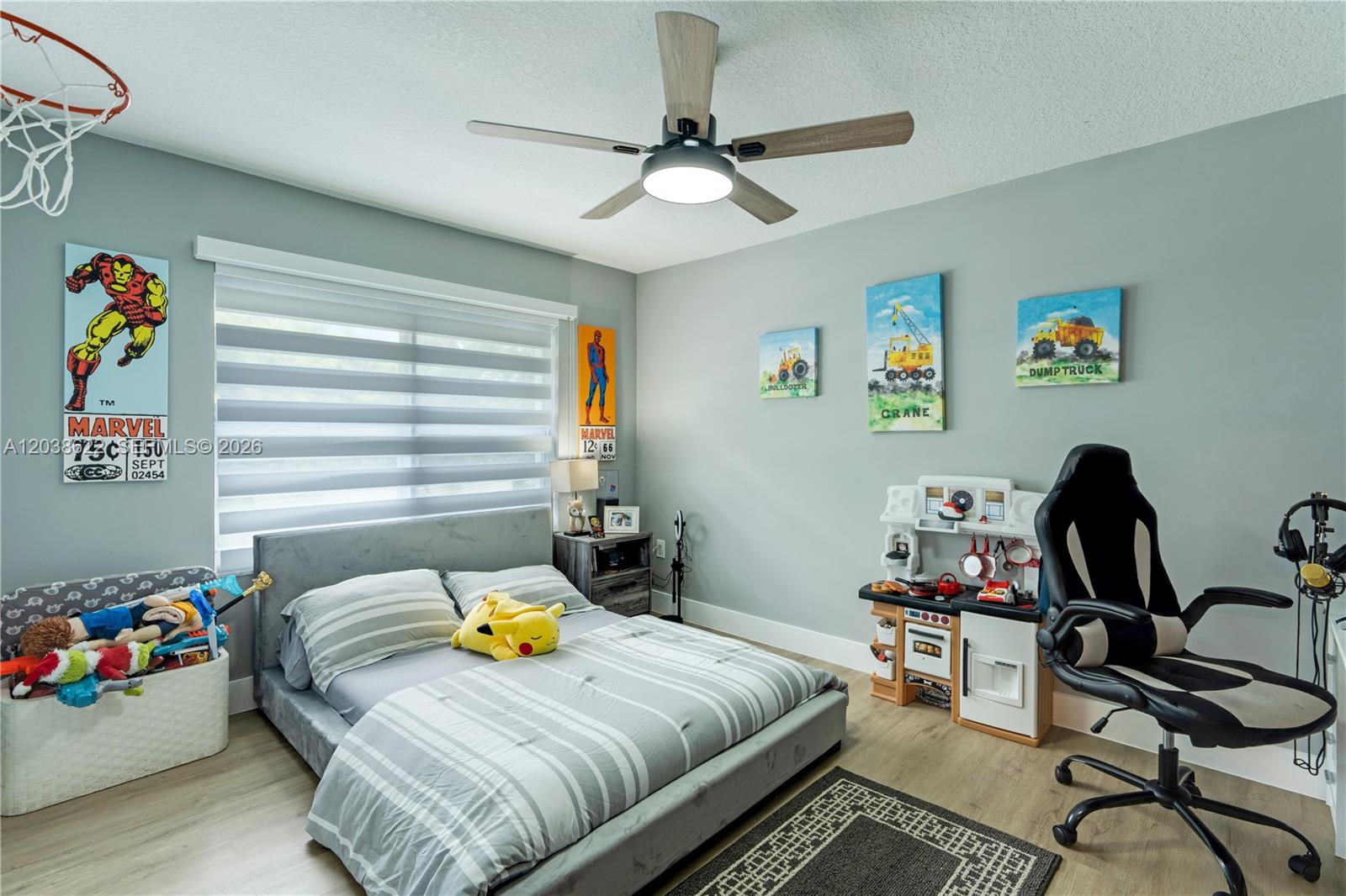14830 Southwest 149th Street Miami, FL 33196 - Photo 18 of 43 a bedroom with a bed and a chandelier