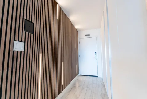 a room with wooden floors and pool table