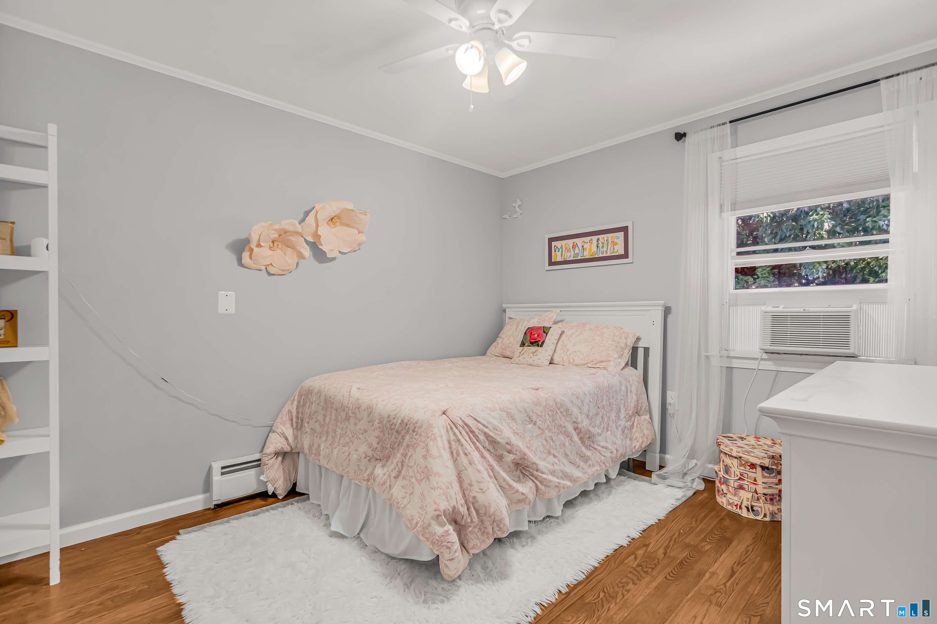13 Pleasant Rise Circle Brookfield, CT 06804 - Photo 36 of 40 a bedroom with a bed and a chandelier