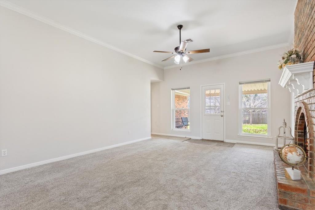 327 East Chapman Road Hewitt, TX 76643 - Photo 12 of 30 an empty room with windows and fireplace